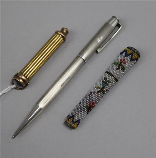 A silver yard olead pen, needle case and a propelling pencil